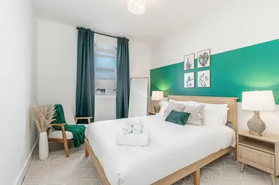 a bedroom with a bed with a teddy bear on it at Event-Ready 2BR 2BA Near Stadium & Beach includes Parking and Washer and Dryer in Hallandale Beach