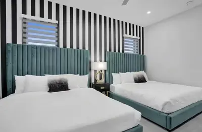 two beds in a room with two beds sidx sidx sidx at New Construction Villa HotTub Heated Pool Gameroom in Fort Lauderdale