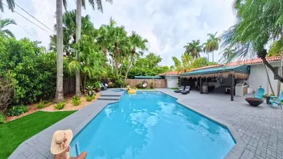 a swimming pool in the backyard of a house at Villa Calma Hidden Tropical Gem with Gym and Pool in Hollywood