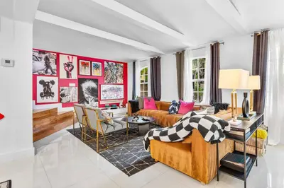 a living room with a couch and a table at Luxe 5BR 4BA I Heated Pool 10 Min to Beach I BBQ in Fort Lauderdale