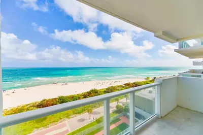 a balcony with a view of the beach at Ocean Breeze Retreat in Miami Beach in Miami Beach
