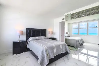 a bedroom with two beds and a large window at Ocean Breeze Retreat in Miami Beach in Miami Beach