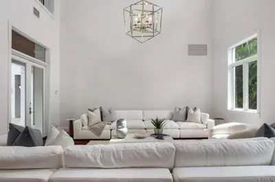 a white living room with a large white couch at New Luxe Super Villa by The Glam Homes in Plantation