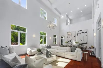 a living room with white furniture and windows at New Luxe Super Villa by The Glam Homes in Plantation