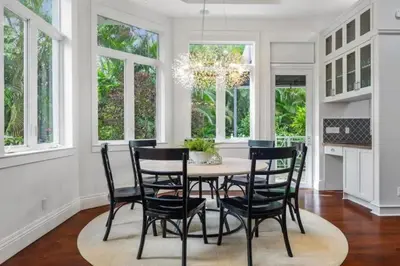 a dining room with a table and chairs at New Luxe Super Villa by The Glam Homes in Plantation