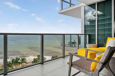 a balcony with a view of the ocean at Auberge Blue by Rove Travel Oceanfront with Balcony in Fort Lauderdale