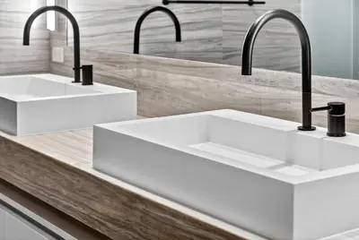 a kitchen with two sinks and two faucets at Auberge Blue by Rove Travel Oceanfront with Balcony in Fort Lauderdale