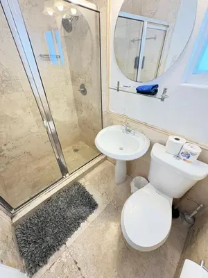 a bathroom with a toilet and a shower and a sink at Incredible South Beach Penthouses with private terrace in Miami Beach