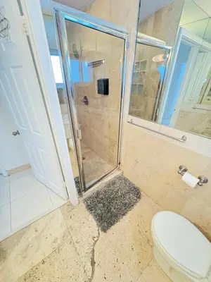 a bathroom with a shower and a toilet at Incredible South Beach Penthouses with private terrace in Miami Beach