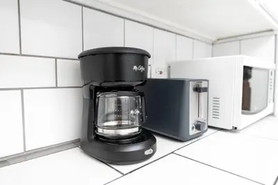 a coffee maker on a counter in a kitchen at The Residences at Lake Ridge Apt 1 in Fort Lauderdale