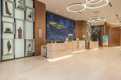 a lobby of a store with a large painting on the wall at 39th Floor Oceanfront Penthouse with Pool & Gym in Hollywood