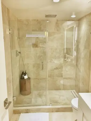 a shower with a glass door in a bathroom at Amazing View 1 Hotel Corner Unit 2BR/2BA w Balcony in Miami Beach