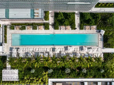 an overhead view of a resort with a swimming pool at Resort & Beach - The Ideal Condo at 72 Park in Miami Beach