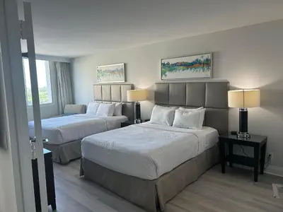 a hotel room with two beds and two lamps at Ocean Breeze Condo - Intracostal and Ocean views at GalleryOne in Fort Lauderdale