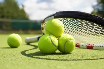 a bunch of tennis balls on a tennis racket at Skyline View Private Residence at Carillon Resort - 705 in Miami Beach
