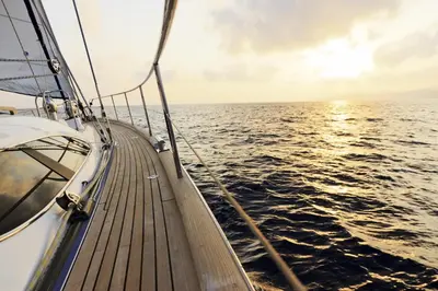 a boat on the water at sunset at Oceanview Private Residence at 1 Hotel and Homes - 1202 in Miami Beach