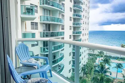 a balcony with two chairs and a view of the ocean at The Azul Beachview Get away in Hollywood
