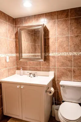 a bathroom with a sink and a toilet at The Azul Beachview Get away in Hollywood