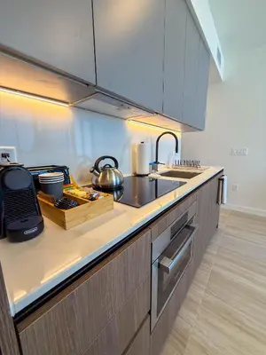a kitchen with a sink and a counter top at Luxury View-Walk to beach! in Miami Beach