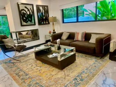 a living room with a couch and a coffee table at MIAMi MID-CENTURY GEM in North Miami Beach