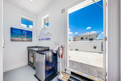a room with a door open to a balcony at Walk to Hollywood Beach Luxury Family Getaway! in Hollywood