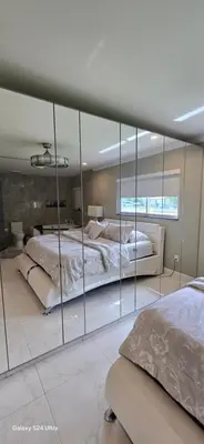 a mirror in a bedroom with two beds at Miami Lifestyle, Modern, Private heated Pool, BBQ in North Miami Beach