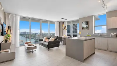 a kitchen and living room with a view of the city at Hyde House in Hollywood