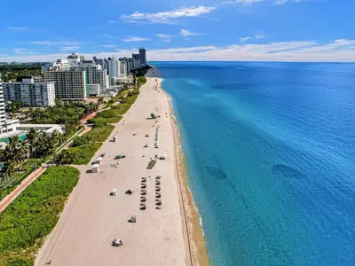 an aerial view of a beach and the ocean at Stylish 3BR Retreat Steps from the Beach with Resort Amenities 1508 in Miami Beach