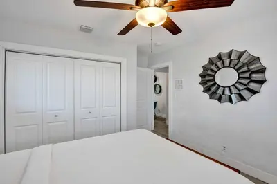 a bedroom with a bed and a ceiling fan at Casa Sol B in Fort Lauderdale