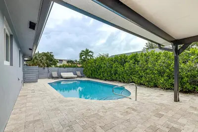 a swimming pool in the backyard of a house at Walkable Island City Oasis with Private Heated Pool! in Fort Lauderdale