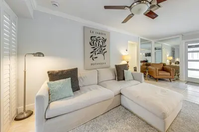 a living room with a white couch in a room at Walkable Island City Oasis with Private Heated Pool! in Fort Lauderdale