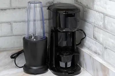 a black blender sitting on a counter next to a wall at Miami Modern Studio minutes to Wynwood & Downtown in Miami