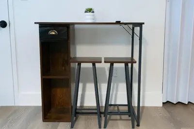 a desk with two stools next to a shelf at Miami Modern Studio minutes to Wynwood & Downtown in Miami