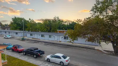 a group of cars parked in a parking lot at Miami Modern Studio minutes to Wynwood & Downtown in Miami
