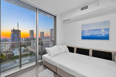 a bedroom with a bed and a large window at CAL KING BED Downtown Miami Free Parking Pool Gym in Miami