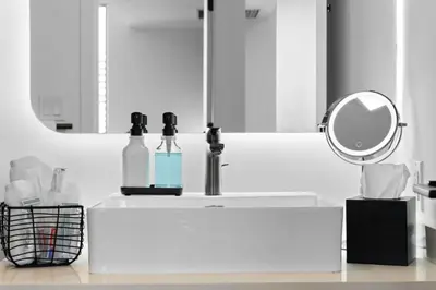a white bathroom with a sink and a mirror at CAL KING BED Downtown Miami Free Parking Pool Gym in Miami