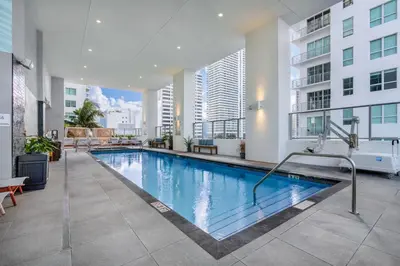 a swimming pool in the middle of a building at CAL KING BED Downtown Miami Free Parking Pool Gym in Miami
