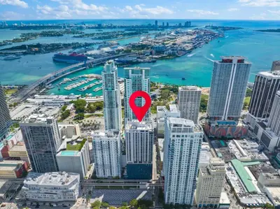 a red arrow on top of a city at CAL KING BED Downtown Miami Free Parking Pool Gym in Miami