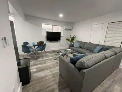 a living room with a couch and a table at KING OF MIAMI - 2bd Retreat 1 mile from Brickell in Miami