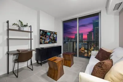 a living room with a couch and a large window at KING OF MIAMI - Downtown Free Parking Pool Gym in Miami