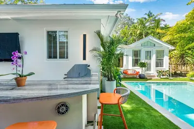 a backyard with a swimming pool and a house at Garden Grove- Miami Home with Private Pool in Miami