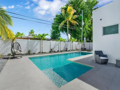 a swimming pool in the backyard of a house at Villa Coral Bay in Miami Beach