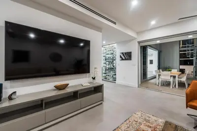 a living room with a large flat screen tv at Villa Modern Miami glamour in Miami