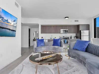 a living room with a couch and a table at X Lounge VII-Private Sky Residence in Miami