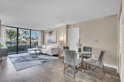 a living room with a couch and a table at Centrally Located 2 BED in the Heart of NMB in North Miami