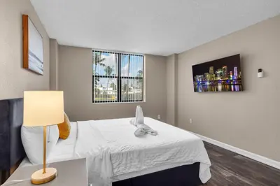 a bedroom with a bed with a stuffed animal on it at Centrally Located 2 BED in the Heart of NMB in North Miami