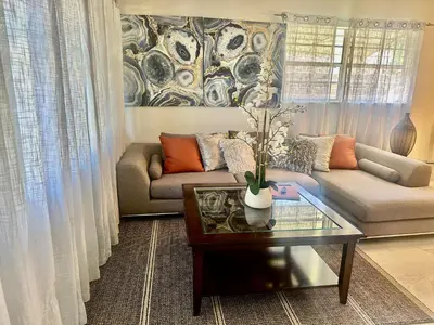 a living room with a couch and a coffee table at Beach and Downtown Hollywood in Hollywood