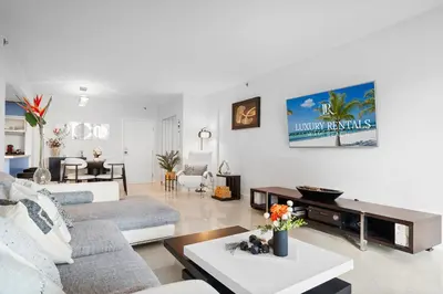 a living room with a couch and a table at Roney Palace 408 in Miami Beach
