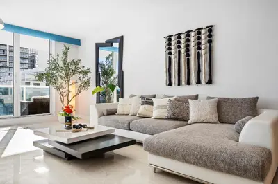 a living room with a couch and a coffee table at Roney Palace 408 in Miami Beach