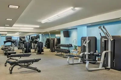 a gym with several treadmills and cardio machines at AKA Hotel Stunning Views w- Free parking in Miami
